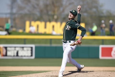 MESA, AZ – February 24: Brian Howard of the Oakland Athletics pitches. He is Rule 5 Draft eligible. (Photo by Michael Zagaris/Oakland Athletics/Getty Images)