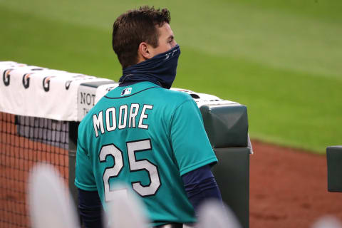 SEATTLE, WASHINGTON – JULY 31: Dylan Moore #25 of the Seattle Mariners watches play in the seventh inning against the Oakland Athletics during their Opening Day game at T-Mobile Park on July 31, 2020 in Seattle, Washington. (Photo by Abbie Parr/Getty Images)