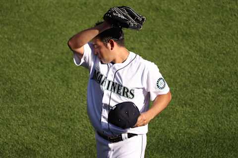 SEATTLE, WASHINGTON – AUGUST 01: Yusei Kikuchi #18 of the Seattle Mariners reacts while warming up prior to taking on the Oakland Athletics at T-Mobile Park on August 01, 2020 in Seattle, Washington. (Photo by Abbie Parr/Getty Images)