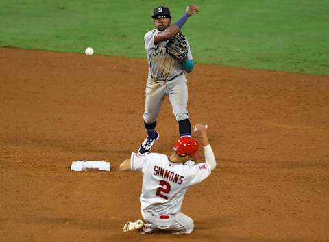 ANAHEIM, CA – AUGUST 29: Shed Long Jr. of the Seattle Mariners turns a double play against the Angels. (Photo by John McCoy/Getty Images)