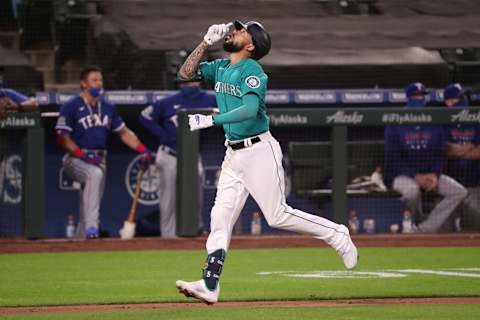 SEATTLE, WASHINGTON – SEPTEMBER 04: J.P. Crawford #3 of the Seattle Mariners celebrates while lapping the bases after hitting a three run home run against the Texas Rangers in the eighth inning at T-Mobile Park on September 04, 2020 in Seattle, Washington. (Photo by Abbie Parr/Getty Images)