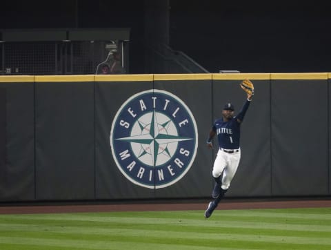 SEATTLE, WA – SEPTEMBER 14: Kyle Lewis of the Seattle Mariners holds up his glove after robbing a home run. (Photo by Lindsey Wasson/Getty Images)