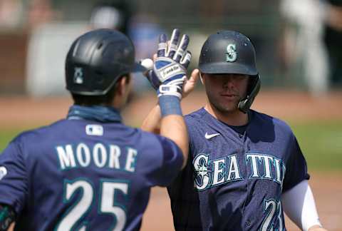 SAN FRANCISCO, CALIFORNIA – SEPTEMBER 17: Ty France #23 of the Seattle Mariners is congratulated by Dylan Moore #25 after France scored against the San Francisco Giants in the bottom of the second inning at Oracle Park on September 17, 2020 in San Francisco, California. (Photo by Thearon W. Henderson/Getty Images)