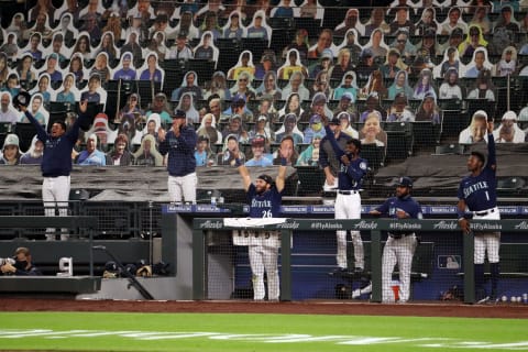 SEATTLE, WASHINGTON – SEPTEMBER 21: The Seattle Mariners celebrate a three-run home run. (Photo by Abbie Parr/Getty Images)