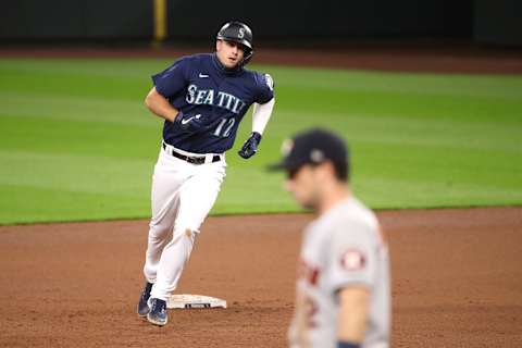 SEATTLE, WASHINGTON – SEPTEMBER 21: Evan White #12 of the Seattle Mariners laps the bases. (Photo by Abbie Parr/Getty Images)