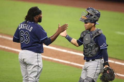 SAN DIEGO, CALIFORNIA – OCTOBER 07: Diego Castillo and Michael Perez of the Tampa Bay Rays celebrate their team’s victory. (Photo by Christian Petersen/Getty Images)