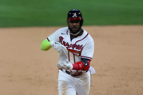 ARLINGTON, TEXAS – OCTOBER 15: Marcell Ozuna #20 of the Atlanta Braves celebrates after hitting a solo home run against the Los Angeles Dodgers during the seventh inning in Game Four of the National League Championship Series at Globe Life Field on October 15, 2020 in Arlington, Texas. (Photo by Ronald Martinez/Getty Images)