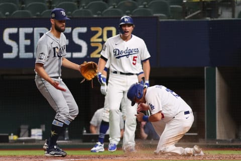 ARLINGTON, TEXAS – OCTOBER 27: Austin Barnes of the Dodgers slides in safely past Nick Anderson of the Rays on a wild pitch. (Photo by Tom Pennington/Getty Images)