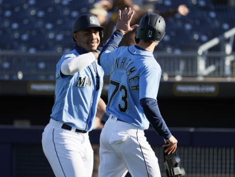 PEORIA, ARIZONA – FEBRUARY 28: Julio Rodriguez of the Mariners celebrates during a spring training game (Ichiro). (Photo by Steph Chambers/Getty Images)