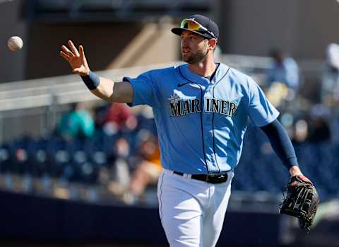 PEORIA, ARIZONA – FEBRUARY 28: Mitch Haniger of the Seattle Mariners tosses a ball in the third inning. (Sodo Mojo). (Photo by Steph Chambers/Getty Images)