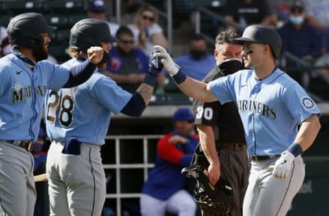 MESA, ARIZONA – MARCH 03: Jose Marmolejos and Mariners prospect Jarred Kelenic react after a home run. (Photo by Steph Chambers/Getty Images)