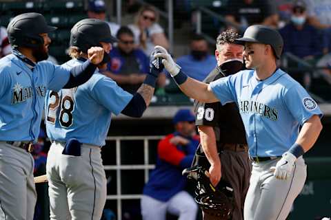 MESA, ARIZONA – MARCH 03: Jose Marmolejos and Mariners prospect Jarred Kelenic react after a home run. (Photo by Steph Chambers/Getty Images)