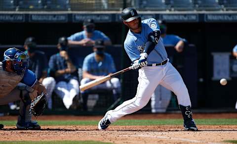 PEORIA, ARIZONA – MARCH 09: Ty France #23 of the Seattle Mariners hits a double. Ty France fantasy baseball. (Photo by Ralph Freso/Getty Images)