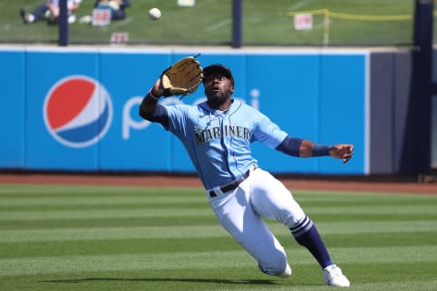 PEORIA, ARIZONA – MARCH 15: Taylor Trammell, a Mariners prospect, makes a sliding catch. (Photo by Abbie Parr/Getty Images)