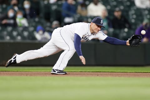 SEATTLE, WASHINGTON – APRIL 06: Kyle Seager of the Mariners dives for the ball against the White Sox. (Photo by Steph Chambers/Getty Images)