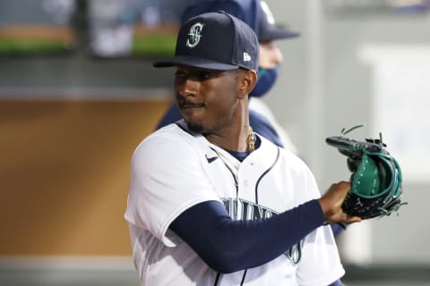 SEATTLE, WASHINGTON – APRIL 07: Justin Dunn of the Mariners reacts after being pulled from the game against the White Sox. (Photo by Steph Chambers/Getty Images)