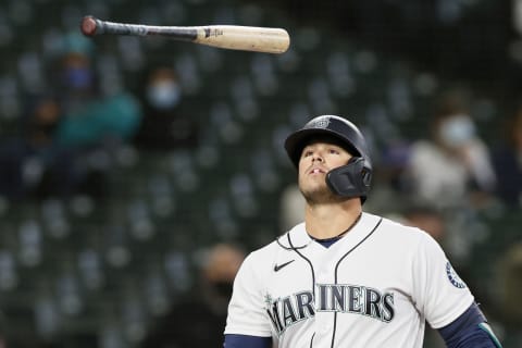 SEATTLE, WASHINGTON – APRIL 07: Ty France of the Mariners flips his bat after he struck out against the White Sox. (Photo by Steph Chambers/Getty Images)