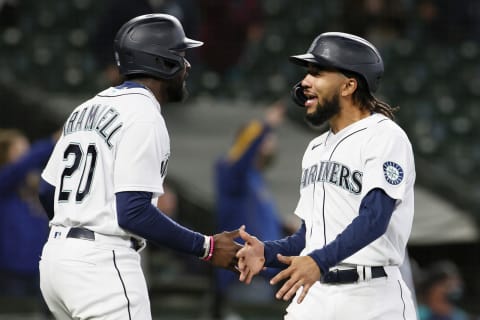 SEATTLE, WASHINGTON – APRIL 07: Taylor Trammell and J.P. Crawford of the Mariners react after scoring against the White Sox. (Photo by Steph Chambers/Getty Images)