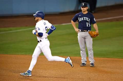 LOS ANGELES, CALIFORNIA - MAY 11: Gavin Lux #9 of the Los Angeles Dodgers rounds the bases after hitting a three-run home run against the Seattle Mariners during the eighth inning at Dodger Stadium on May 11, 2021 in Los Angeles, California. The Dodgers won 6-4. (Photo by Michael Owens/Getty Images)