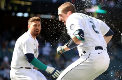 SEATTLE, WASHINGTON – MAY 31: Tom Murphy #2 of the Seattle Mariners is doused with water after hitting a game-winning sacrifice fly. (Photo by Abbie Parr/Getty Images)