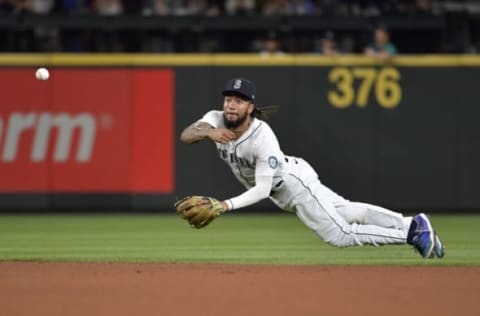 SEATTLE, WASHINGTON – JULY 03: J.P. Crawford #3 of the Seattle Mariners makes a throw from his knees to first base during the game against the Texas Rangers at T-Mobile Park on July 03, 2021 in Seattle, Washington. The Texas Rangers beat the Seattle Mariners 7-3. (Photo by Alika Jenner/Getty Images)