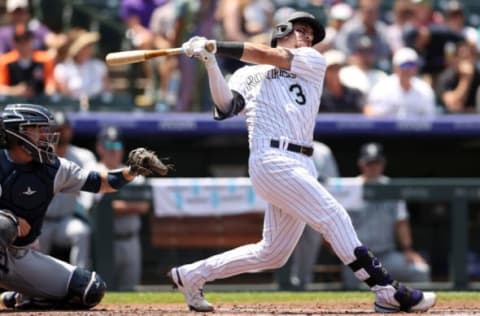 DENVER, COLORADO – JULY 21: Dom Nunez #3 of the Colorado Rockies hits a 3 RBI double against the Seattle Mariners. (Photo by Matthew Stockman/Getty Images)