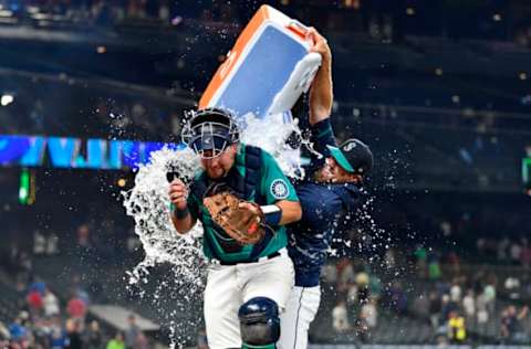 SEATTLE, WASHINGTON – JULY 23: Cal Raleigh #29 of the Seattle Mariners gets a Gatorade bath. (Photo by Alika Jenner/Getty Images)