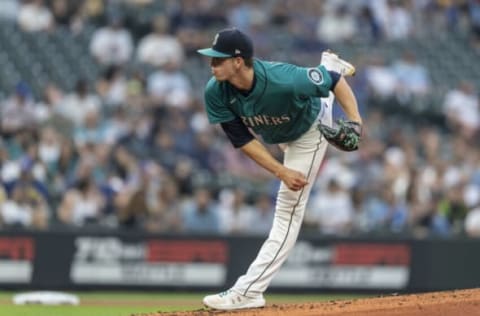 SEATTLE, WASHINGTON – AUGUST 13: Starter Chris Flexen #77 of the Seattle Mariners delivers a pitch during a game against the Toronto Blue Jays at T-Mobile Park on August 13, 2021 in Seattle, Washington. The Mariners won 3-2. (Photo by Stephen Brashear/Getty Images)