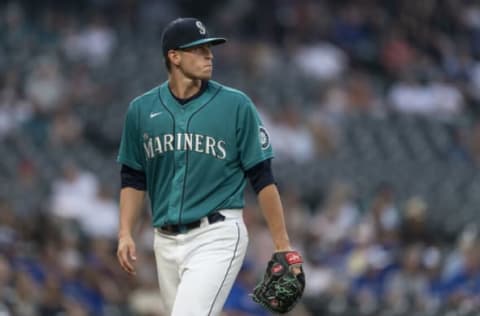 SEATTLE, WASHINGTON – AUGUST 13: Starting pitcher Chris Flexen #77 of the Seattle Mariners walks off the field during a game against the Toronto Blue Jays at T-Mobile Park on August 13, 2021 in Seattle, Washington. The Mariners won 3-2. (Photo by Stephen Brashear/Getty Images)