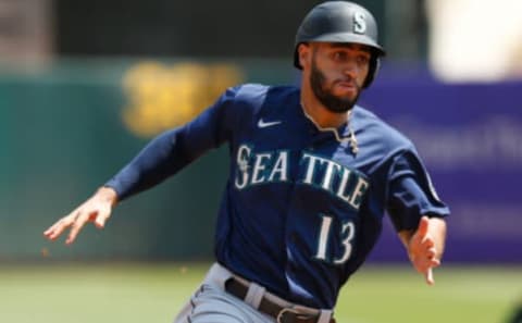 Mariners base runner Abraham Toro rounds the bases to score against the Oakland Athletics. (Photo by Lachlan Cunningham/Getty Images)