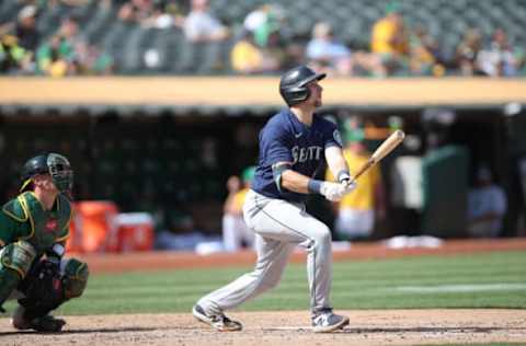 OAKLAND, CA – SEPTMEBER 23: Cal Raleigh #29 of the Seattle Mariners hits a home run during the game against the Oakland Athletics at RingCentral Coliseum on September 23, 2021 in Oakland, California. The Mariners defeated the Athletics 6-5. (Photo by Michael Zagaris/Oakland Athletics/Getty Images)