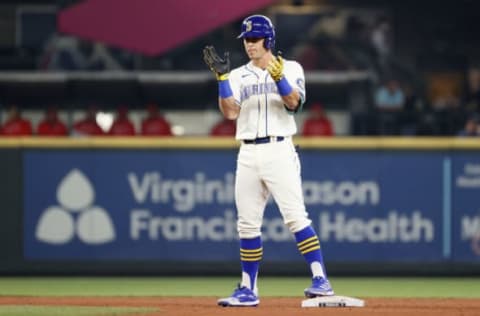 SEATTLE, WASHINGTON – OCTOBER 03: Dylan Moore #25 of the Seattle Mariners reacts after his double against the Los Angeles Angels at T-Mobile Park on October 03, 2021 in Seattle, Washington. (Photo by Steph Chambers/Getty Images)