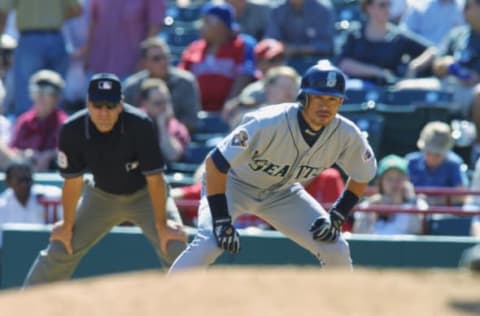 ARLINGTON, TX – SEPTEMBER 26: Ichiro Suzuki #15 of the Seattle Mariners leads off during the game against the Texas Rangers on September 26, 2001 at The Ballpark in Arlington in Arlington, Texas. The Mariners won 7-5. (Photo by Ronald Martinez/Getty Images)