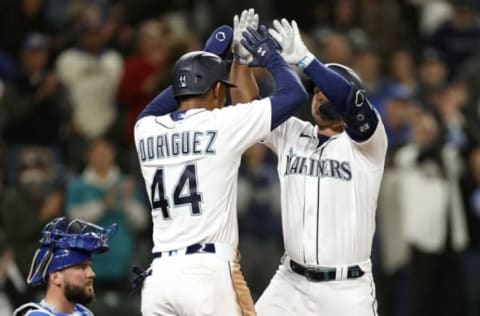 SEATTLE, WASHINGTON – APRIL 23: Julio Rodriguez #44 and Ty France #23 of the Seattle Mariners celebrate France’s three run home run during the eighth inning against the Kansas City Royals at T-Mobile Park on April 23, 2022 in Seattle, Washington. (Photo by Steph Chambers/Getty Images)