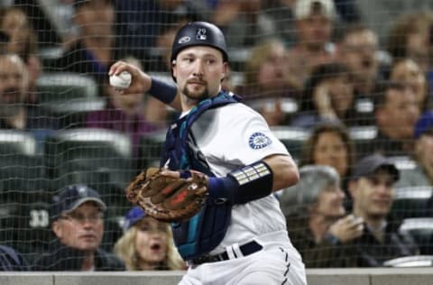 SEATTLE, WASHINGTON – MAY 24: Cal Raleigh #29 of the Seattle Mariners makes a play against the Oakland Athletics at T-Mobile Park on May 24, 2022 in Seattle, Washington. (Photo by Steph Chambers/Getty Images)