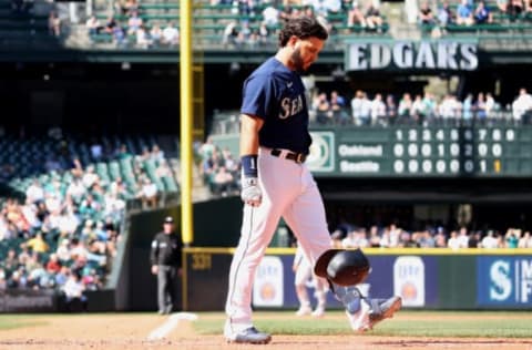 SEATTLE, WASHINGTON – MAY 25: Eugenio Suarez #28 of the Seattle Mariners throws his helmet after striking out during the eighth inning against the Oakland Athletics at T-Mobile Park on May 25, 2022 in Seattle, Washington. (Photo by Steph Chambers/Getty Images)