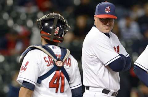 CLEVELAND, OH – MAY 9: Catcher Carlos Santana #41 talks with manager Manny Acta #11 of the Cleveland Indians during a pitching change in the seventh inning against the Chicago White Sox at Progressive Field on May 9, 2012 in Cleveland, Ohio. (Photo by Jason Miller/Getty Images)