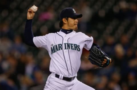 SEATTLE, WA – SEPTEMBER 25: Starting pitcher Hisashi Iwakuma #18 of the Seattle Mariners pitches in the third inning against the Kansas City Royals at Safeco Field on September 25, 2013 in Seattle, Washington. The Mariners defeated the Royals 6-0.(Photo by Otto Greule Jr/Getty Images)