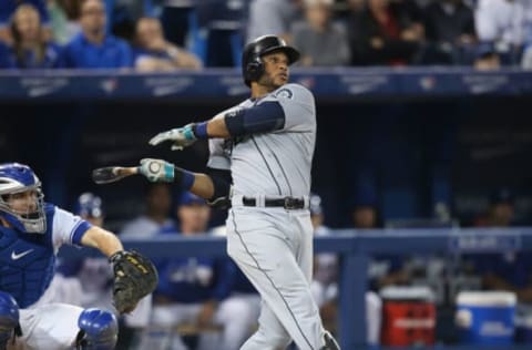 TORONTO, CANADA – SEPTEMBER 23: Robinson Cano #22 of the Seattle Mariners bats in the eighth inning during MLB game action against the Toronto Blue Jays on September 23, 2014 at Rogers Centre in Toronto, Ontario, Canada. (Photo by Tom Szczerbowski/Getty Images)