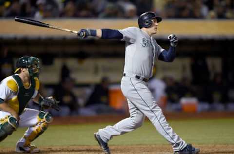 OAKLAND, CA – SEPTEMBER 04: Logan Morrison #20 of the Seattle Mariners hits a bases-loaded two-run double against the Oakland Athletics in the top of the third inning at O.co Coliseum on September 4, 2015 in Oakland, California. Robinson Cano #22 and Franklin Gutierrez #30 scored on the double. (Photo by Thearon W. Henderson/Getty Images)