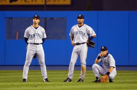 NEW YORK – MAY 14: Raul Ibanez #28, Randy Winn #2, and Ichiro Suzuki #51 of the Seattle Mariners wait during a pitching change in their game against the New York Yankees on May 14, 2004 at Yankee Stadium in the Bronx borough of New York City. (Photo by Al Bello/Getty Images)