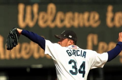 SEATTLE, UNITED STATES: Seattle Mariner Freddy Garcia unwinds a pitch during the second inning against the Cleveland Indians in the opening game in their best-of-five American League Divisional series 09 October 2001 in Seattle. The Venezuelan native gave up three runs in 5 and 2/3 innings work while taking the loss. AFP PHOTO/Dan LEVINE (Photo credit should read DAN LEVINE/AFP via Getty Images)