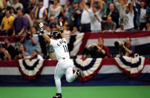 SEATTLE – OCTOBER 7: Edgar Martinez #11 of the Seattle Mariners hits a three-run home run in the third inning of Game four of the 1995 American League Divisional Series against the New York Yankees at the Kingdome on October 7, 1995 in Seattle, Washington. The Mariners defeated the Yankees 11-8. (Photo by Stephen Dunn/Getty Images)