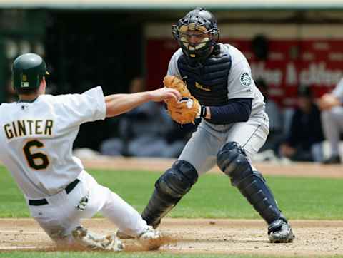 OAKLAND, CA – APRIL 30: Dan Wilson of the Seattle Mariners prepares to tag out Keith Ginter. (Photo by Jed Jacobsohn/Getty Images)