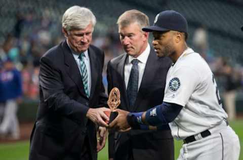 SEATTLE, WA – SEPTEMBER 7: Seattle Mariners Chairman and CEO John Stanton, left, President & Chief Operating Officer Kevin Mather, center, and Robinson Cano #22 of the Seattle Mariners pose for photos after Cano was nominated for the Roberto Clemente Wards before a game against the Texas Rangers at Safeco Field on September 7, 2016 in Seattle, Washington. The Mariners won 8-3. (Photo by Stephen Brashear/Getty Images)