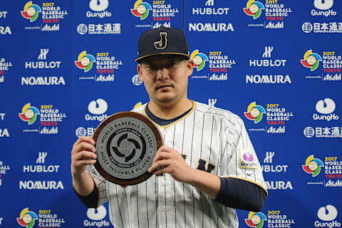 TOKYO, JAPAN – MARCH 10: Outfielder Yoshitomo Tsutsugoh #25 of Japan is awarded the Most Valuable Player award for the Frist Round Pool B after the World Baseball Classic Pool B Game Six between China and Japan at Tokyo Dome on March 10, 2017 in Tokyo, Japan. (Photo by Matt Roberts/Getty Images)