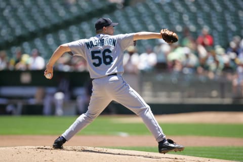 OAKLAND, CA – JUNE 15: Jarrod Washburn #56 of the Seattle Mariners pitches during the game against the Oakland Athletics at the Network Associates Coliseum in Oakland, California on June 15, 2006. The Athletics defeated the Mariners 9-6. (Photo by Don Smith/MLB Photos via Getty Images)