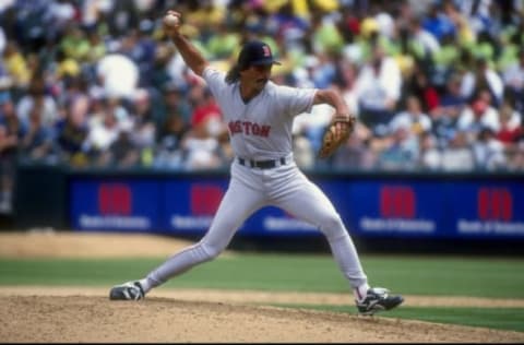 30 Jul 1998: Pitcher Dennis Eckersley #43 of the Boston Red Sox winds up for the pitch during a game against the Oakland Athletics at the Oakland Coliseum in Oakland, California. The Athletics defeated the Red Sox 6-5. Mandatory Credit: Otto Greule Jr./A