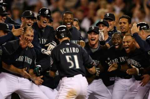 SEATTLE – SEPTEMBER 18: Ichiro Suzuki #51 of the Seattle Mariners is mobbed by teammates after hitting a game winning two-run homer in the bottom of the ninth inning to defeat the New York Yankees 3-2 on September 18, 2009 at Safeco Field in Seattle, Washington. (Photo by Otto Greule Jr/Getty Images)