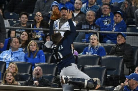 KANSAS CITY, MO – APRIL 10: Mike Marjama #10 of the Seattle Mariners collides into the netting as he tries to catch a foul ball hit by Mike Moustakas #8 of the Kansas City Royals in the first inning at Kauffman Stadium on April 10, 2018 in Kansas City, Missouri. (Photo by Ed Zurga/Getty Images)